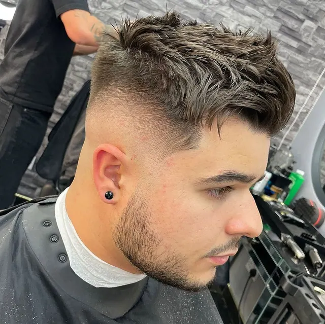 A textured quiff with a skin fade